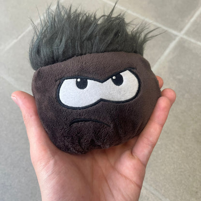 Club Penguin Series 4 Black Puffle Plushie was Released in 2009 by Disney and Jakks Pacific, featuring an angry embroidered face, troll-like hair and a half plush half beanie body. It comes with a Disney-licensed tag.