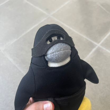 Club Penguin 2009 Series 4 Ninja Penguin Plushie is a black penguin with a black ninja outfit (top+mask) that can be taken off. Released in 2009 by Disney and Jakks Pacific, featuring an embroidered Club Penguin logo on the bottom of the foot. It comes with a Disney-licensed tag.