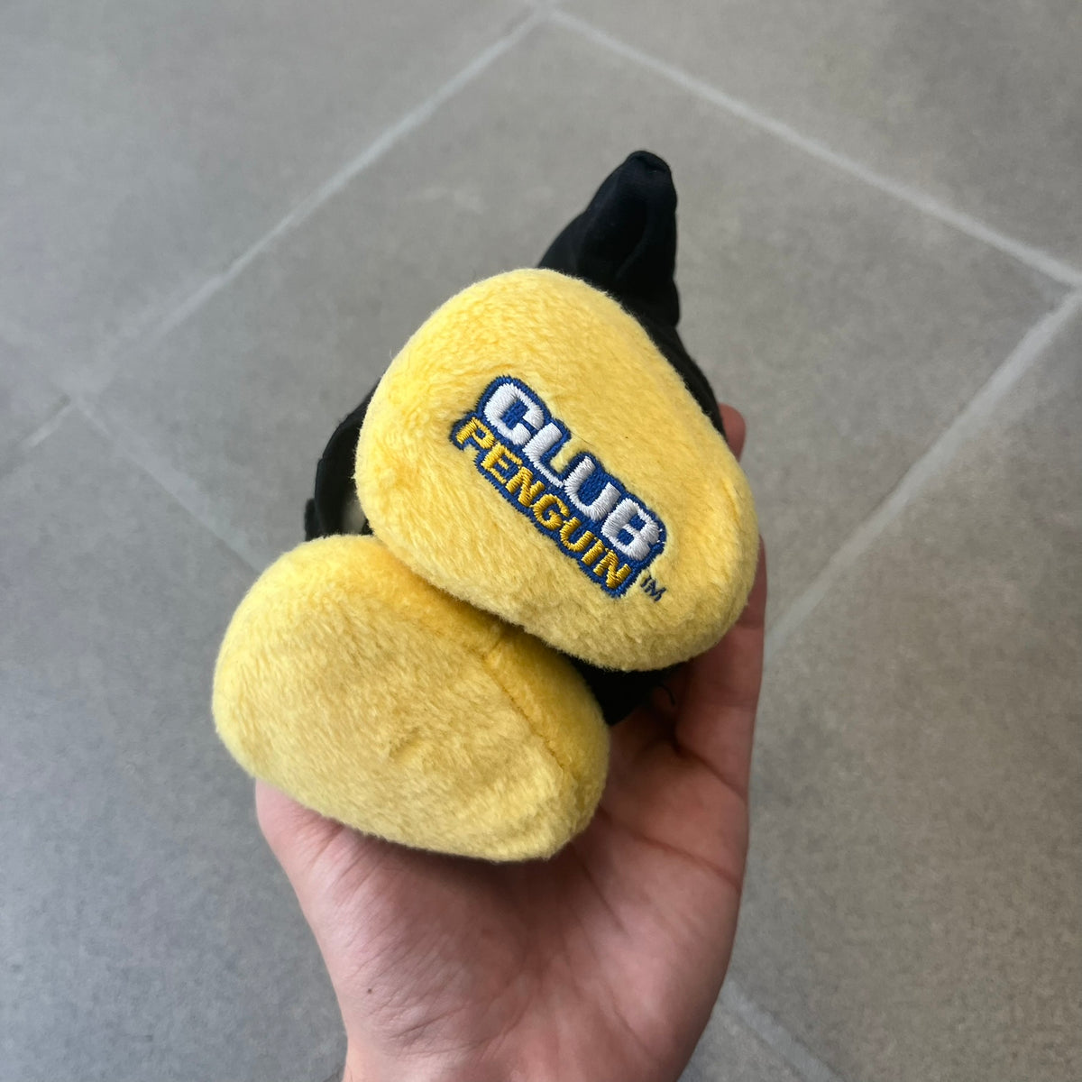 Club Penguin 2009 Series 4 Ninja Penguin Plushie is a black penguin with a black ninja outfit (top+mask) that can be taken off. Released in 2009 by Disney and Jakks Pacific, featuring an embroidered Club Penguin logo on the bottom of the foot. It comes with a Disney-licensed tag.