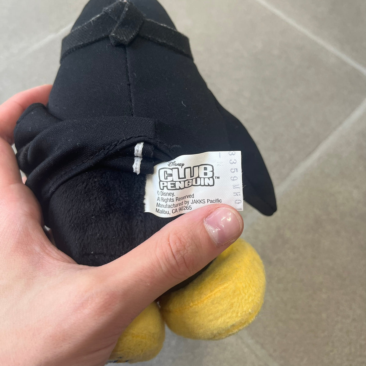 Club Penguin 2009 Series 4 Ninja Penguin Plushie is a black penguin with a black ninja outfit (top+mask) that can be taken off. Released in 2009 by Disney and Jakks Pacific, featuring an embroidered Club Penguin logo on the bottom of the foot. It comes with a Disney-licensed tag.