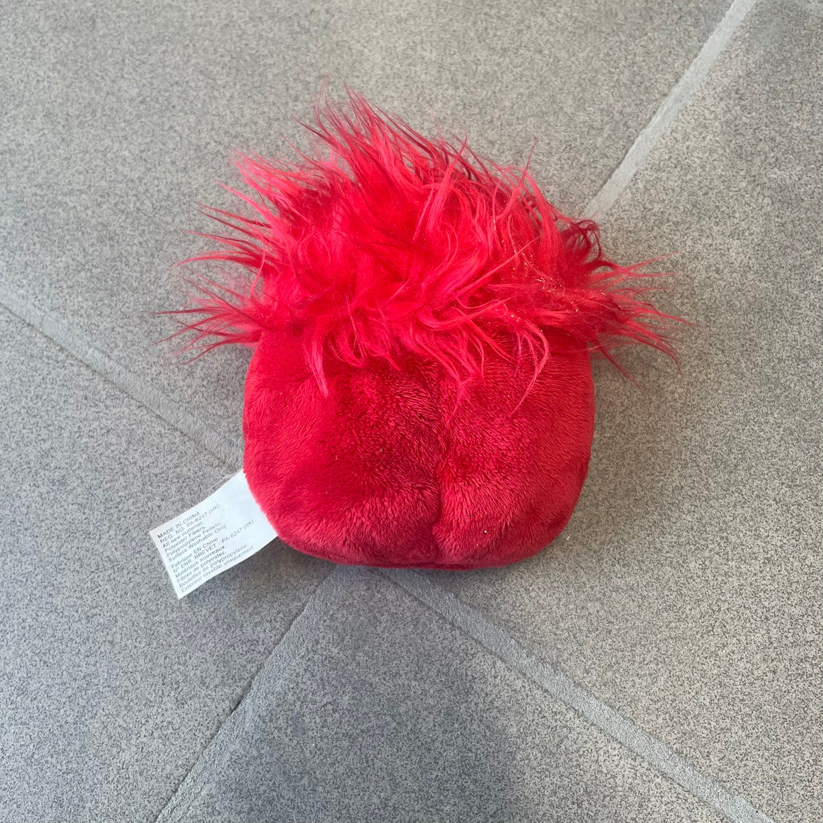 Club Penguin Series 4 Red Puffle Plushie was Released in 2009 by Disney and Jakks Pacific, featuring a smilling embroidered face, troll-like hair and a half plush half beanie body. It comes with a Disney-licensed tag.