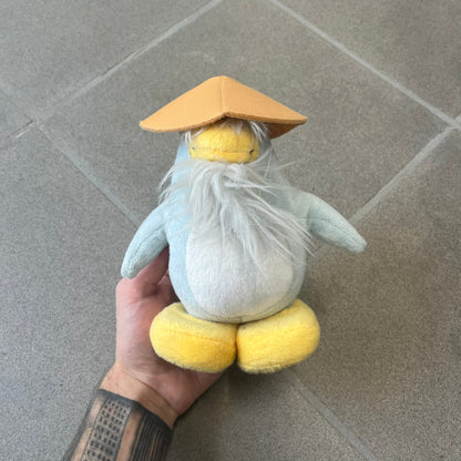 Club Penguin 2009 Series 4 Sensei Penguin Plushie is a gray penguin with a straw hat and long gray beard. Released in 2009 by Disney and Jakks Pacific, featuring an embroidered Club Penguin logo on the bottom of the foot. It comes with a Disney-licensed tag.