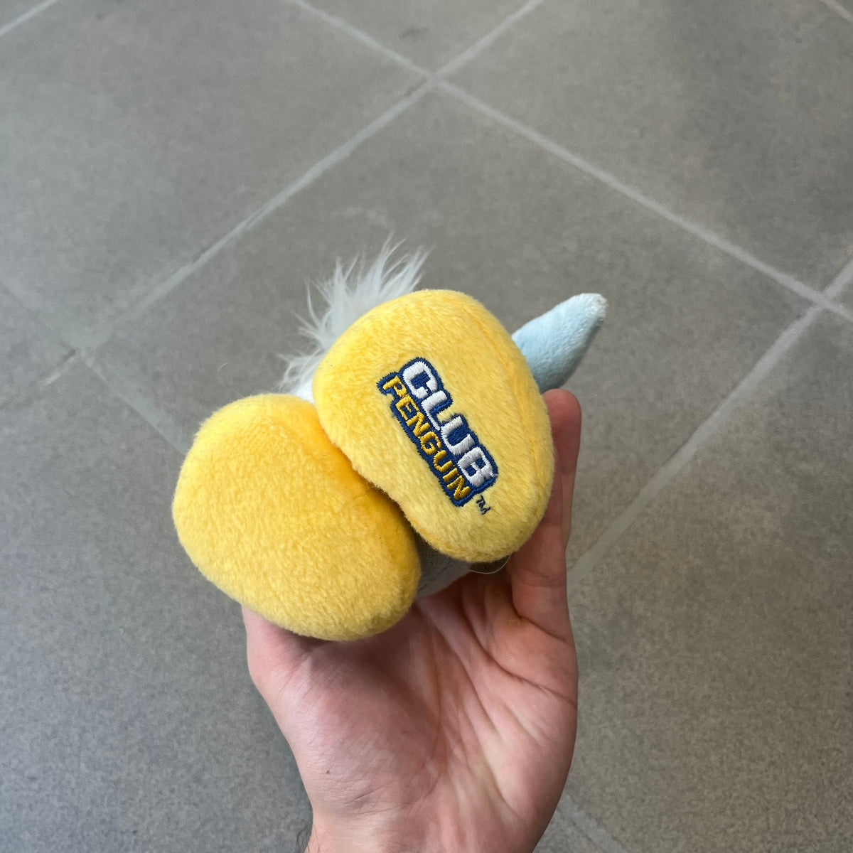 Club Penguin 2009 Series 4 Sensei Penguin Plushie is a gray penguin with a straw hat and long gray beard. Released in 2009 by Disney and Jakks Pacific, featuring an embroidered Club Penguin logo on the bottom of the foot. It comes with a Disney-licensed tag.