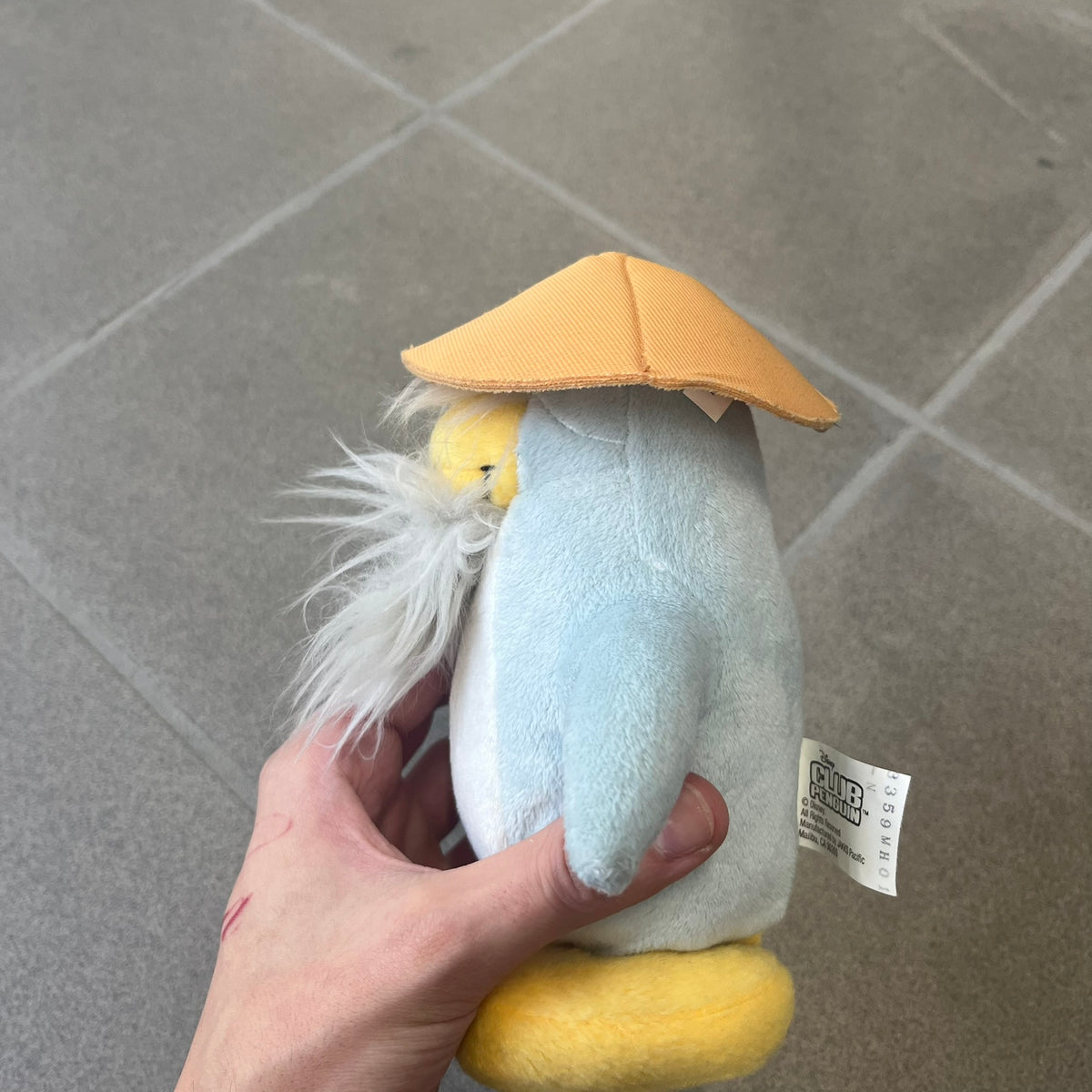 Club Penguin 2009 Series 4 Sensei Penguin Plushie is a gray penguin with a straw hat and long gray beard. Released in 2009 by Disney and Jakks Pacific, featuring an embroidered Club Penguin logo on the bottom of the foot. It comes with a Disney-licensed tag.