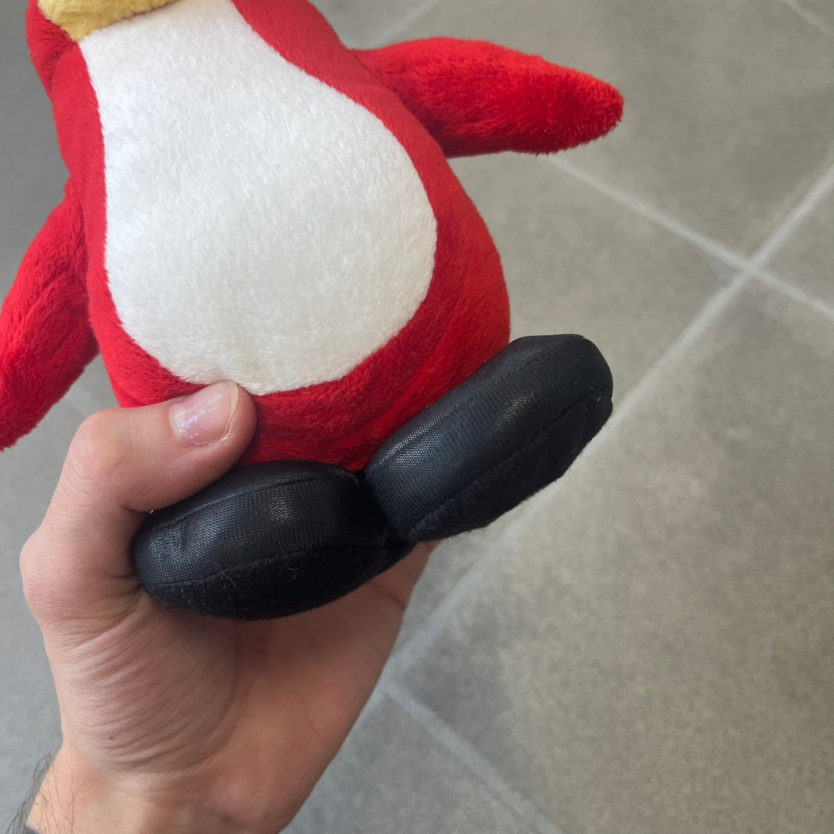 Club Penguin 2010 Series 7 Secret Agent Penguin Plushie is a red penguin with black sunglasses on. He originally had a tuxedo. Released in 2010 by Disney and Jakks Pacific, featuring an embroidered Club Penguin logo on the bottom of the foot. It comes with a Disney-licensed tag.