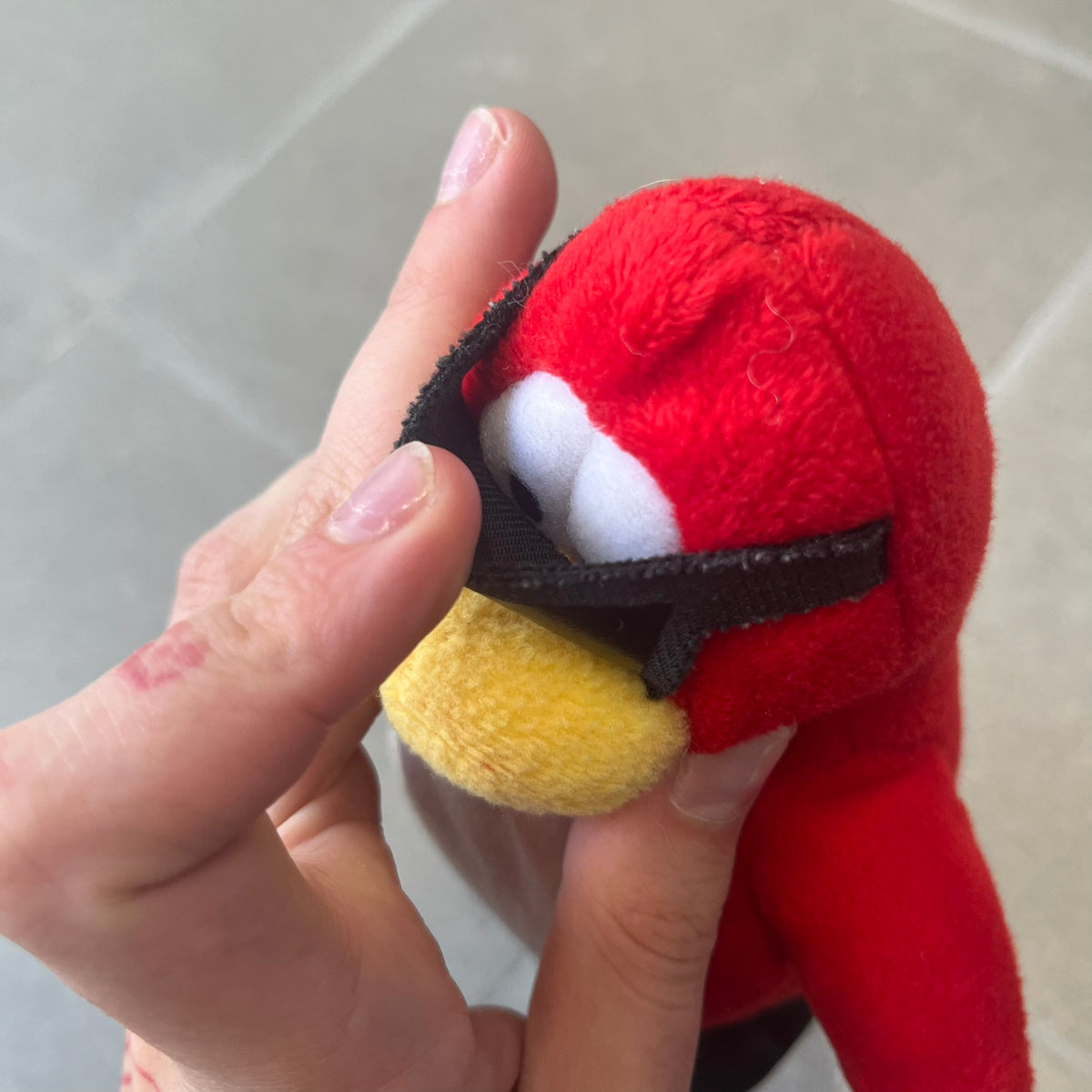 Club Penguin 2010 Series 7 Secret Agent Penguin Plushie is a red penguin with black sunglasses on. He originally had a tuxedo. Released in 2010 by Disney and Jakks Pacific, featuring an embroidered Club Penguin logo on the bottom of the foot. It comes with a Disney-licensed tag.