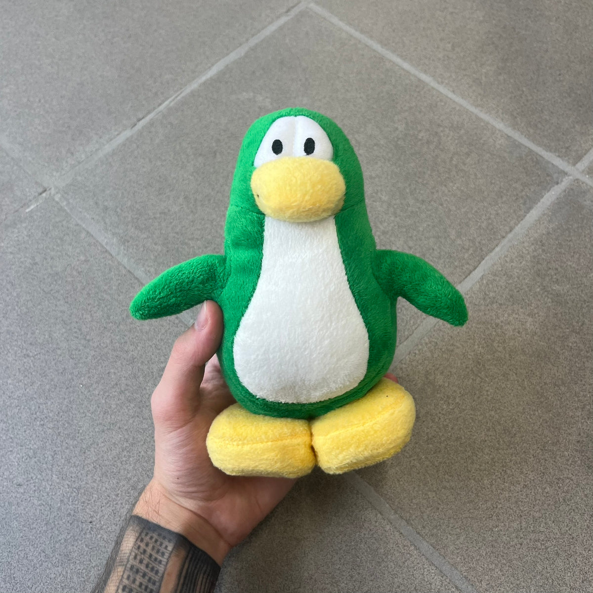 Club Penguin 2011 Series 10 Tree Penguin Plushie is a green penguin. Originally released with a christmas tree outfit, sadly it's missing. Released in 2011&nbsp; by Disney and Jakks Pacific, featuring an embroidered Club Penguin logo on the bottom of the foot. It comes with a Disney-licensed tag.