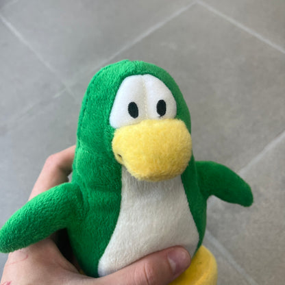 Club Penguin 2011 Series 10 Tree Penguin Plushie is a green penguin. Originally released with a christmas tree outfit, sadly it's missing. Released in 2011&nbsp; by Disney and Jakks Pacific, featuring an embroidered Club Penguin logo on the bottom of the foot. It comes with a Disney-licensed tag.