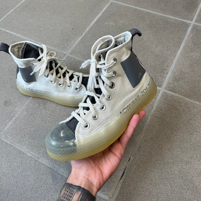 Converse x A-COLD-WALL* Silver Birch Chuck 70 (A02276C) is a limited-edition high-top sneaker from the collaboration with British designer Samuel Ross, released October 6, 2022 in a Silver Birch/Pavement colorway. The canvas upper features a rubber toe cap and a Converse heel plate, with a distinctive translucent, marbled speckled sole.