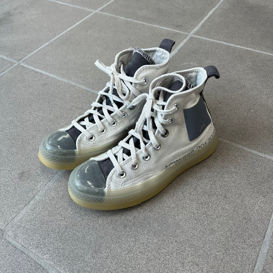 Converse x A-COLD-WALL* Silver Birch Chuck 70 (A02276C) is a limited-edition high-top sneaker from the collaboration with British designer Samuel Ross, released October 6, 2022 in a Silver Birch/Pavement colorway. The canvas upper features a rubber toe cap and a Converse heel plate, with a distinctive translucent, marbled speckled sole.