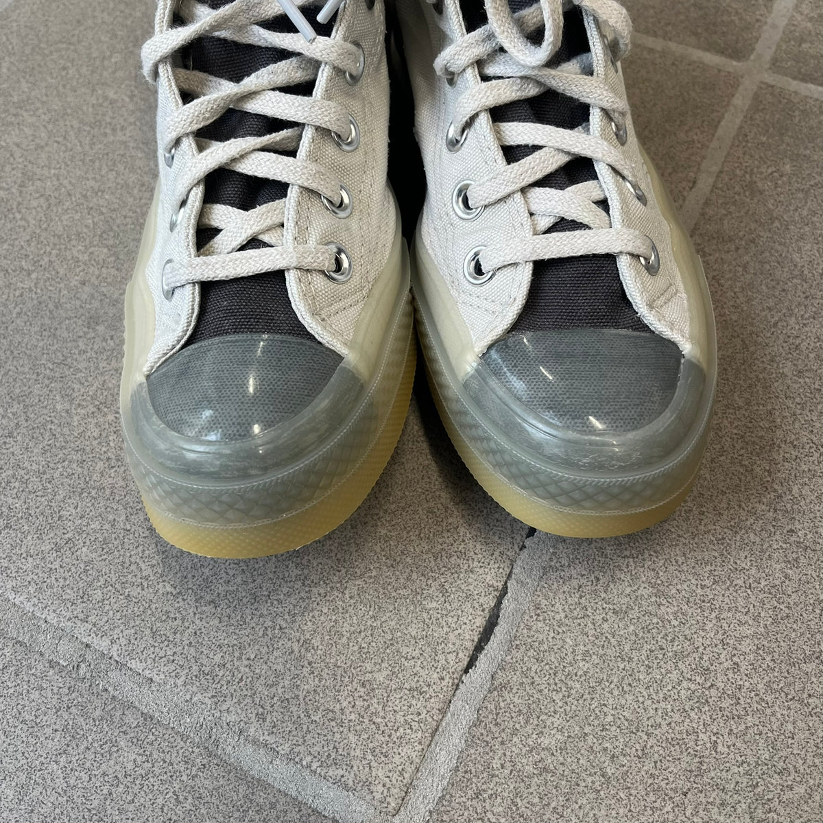 Converse x A-COLD-WALL* Silver Birch Chuck 70 (A02276C) is a limited-edition high-top sneaker from the collaboration with British designer Samuel Ross, released October 6, 2022 in a Silver Birch/Pavement colorway. The canvas upper features a rubber toe cap and a Converse heel plate, with a distinctive translucent, marbled speckled sole.