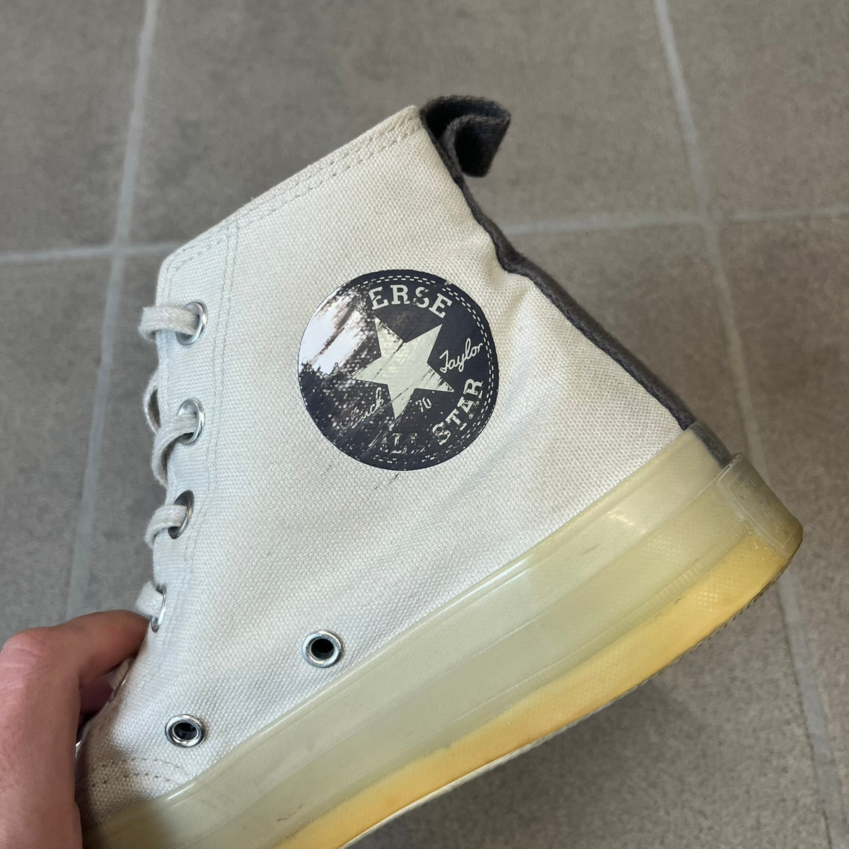 Converse x A-COLD-WALL* Silver Birch Chuck 70 (A02276C) is a limited-edition high-top sneaker from the collaboration with British designer Samuel Ross, released October 6, 2022 in a Silver Birch/Pavement colorway. The canvas upper features a rubber toe cap and a Converse heel plate, with a distinctive translucent, marbled speckled sole.