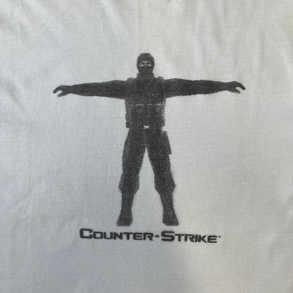 Counter Strike 1.6 Bootleg White Tee is a white, 100% cotton European bootleg made on an "American" blank, featuring a CS 1.6 counter-terrorist model standing with his arms out on the front with "Counter-Strike" text printed below.