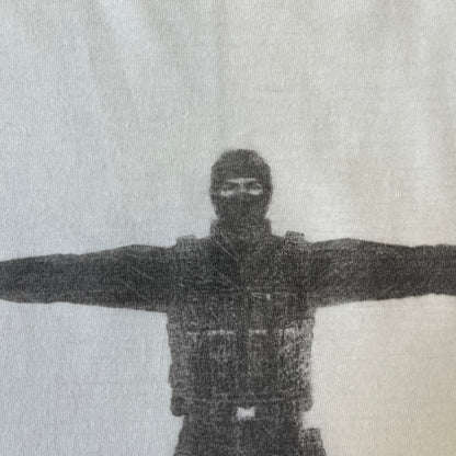 Counter Strike 1.6 Bootleg White Tee is a white, 100% cotton European bootleg made on an "American" blank, featuring a CS 1.6 counter-terrorist model standing with his arms out on the front with "Counter-Strike" text printed below.