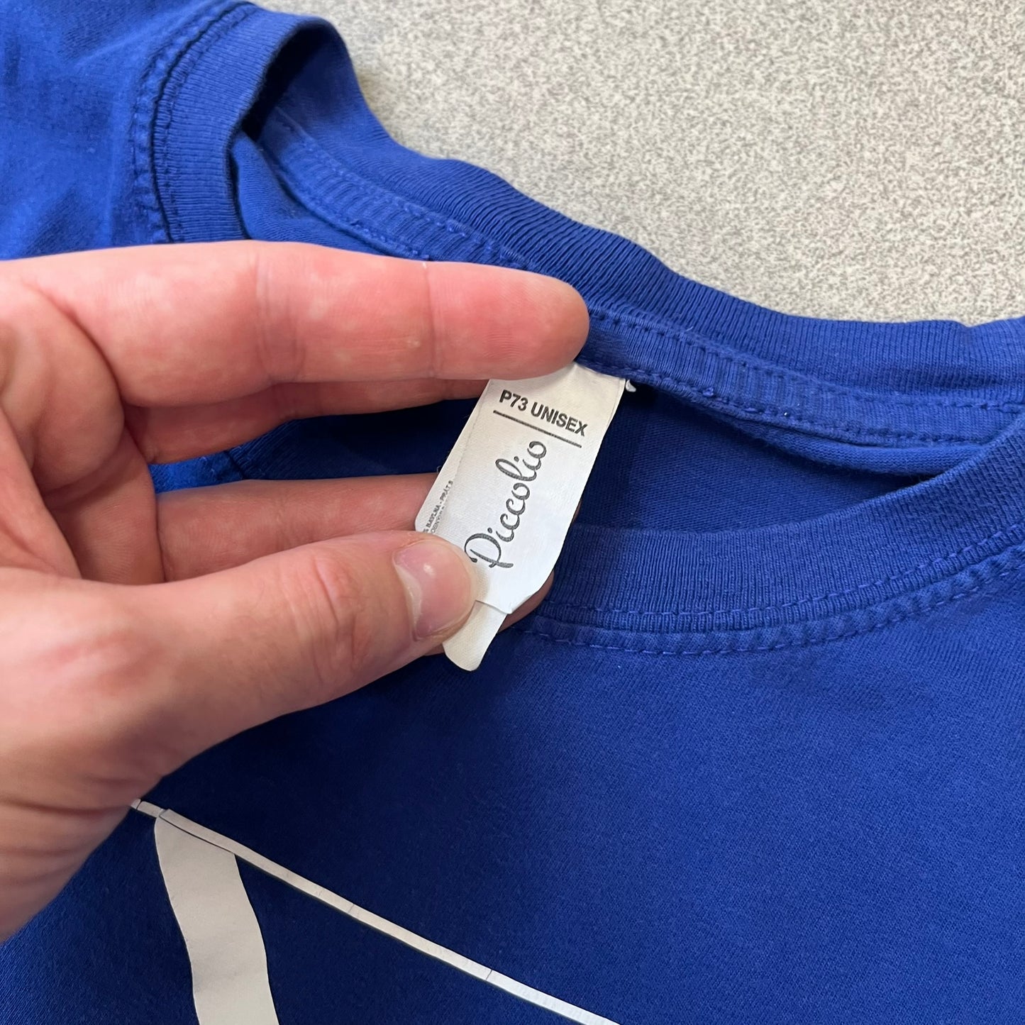 Counter Strike “1 Shot No Kill” Blue Tee features a blue T-shirt made on a Piccolio blank. The front has a Counter-Strike Silver 1 rank graphic with a white “1 Shot No Kill” text underneath. This is not an official Valve release.