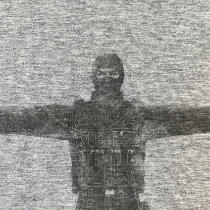 Counter Strike 2000's Bootleg Gray Tee is a gray, 100% cotton European bootleg made in Greece on an "Apple T-Shirt" blank, featuring a CS 1.6 counter-terrorist model T-posing on the front with "Counter-Strike" text printed below.