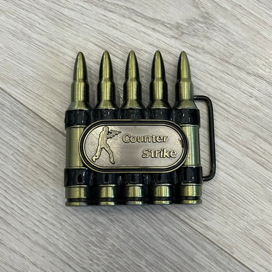 Counter Strike Metal Belt Buckle featuring five metal bullets with black vitreous enamel stripes. Includes a metal dog tag plaque on the front with “Counter Strike” text and the iconic Counter Strike logo of a shooter.