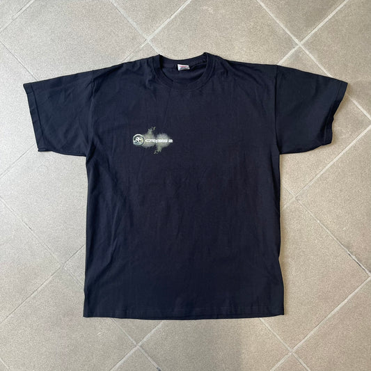 Crysis 2 Promo 2011 Black Tee features a black design with a small Crysis 2 logo on the front right chest printed over a mesh-style graphic inspired by the game. The back features a large graphic of a Force Recon Marine holding a weapon, combined with additional futuristic mesh details from the Crysis universe. Made on a Fruit of the Loom blank.

