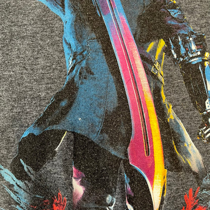 Devil May Cry 5 Promo 2019 Gray Tee is made on a Gildan blank in grey cotton. The front features the Devil May Cry 5 game cover but only with Nero holding his sword, along with large “Devil May Cry 5” text. Made as a promotional T-shirt for the game.