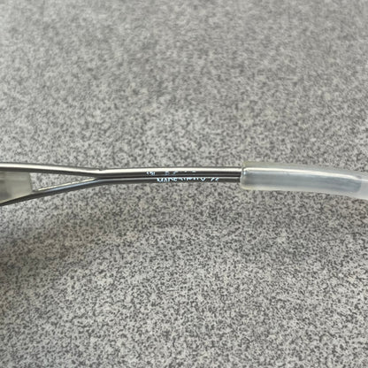 Diesel 2000's Clear Jumbo Sunglasses feature thin silver-tone wire temples with clear plastic sections extending over the ends and front of the frame. The lenses have a grey-tinted transparent finish, with visible screws on the front. A small silver Diesel logo is placed on the side, with white Diesel text printed in the corner of one lens.
