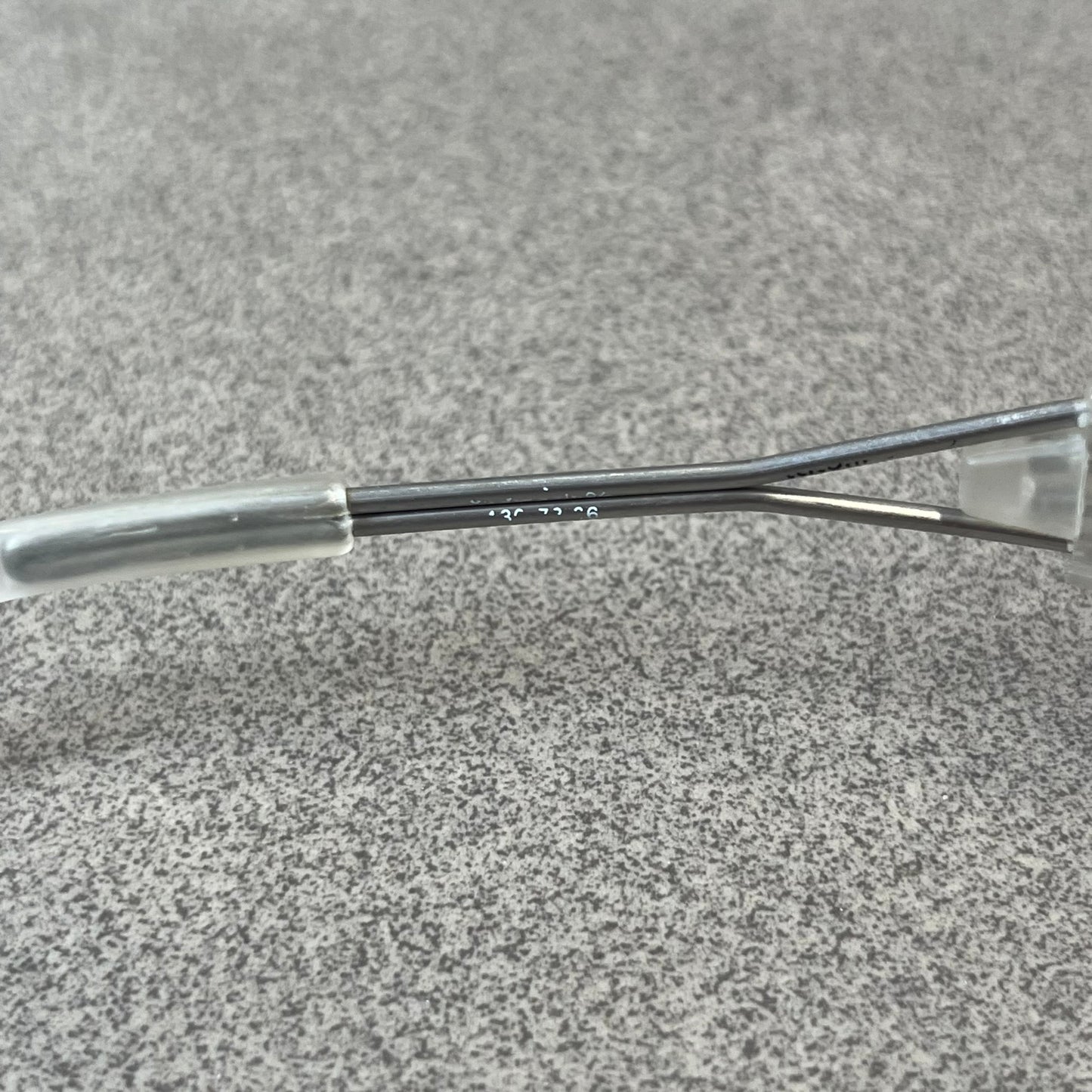 Diesel 2000's Clear Jumbo Sunglasses feature thin silver-tone wire temples with clear plastic sections extending over the ends and front of the frame. The lenses have a grey-tinted transparent finish, with visible screws on the front. A small silver Diesel logo is placed on the side, with white Diesel text printed in the corner of one lens.
