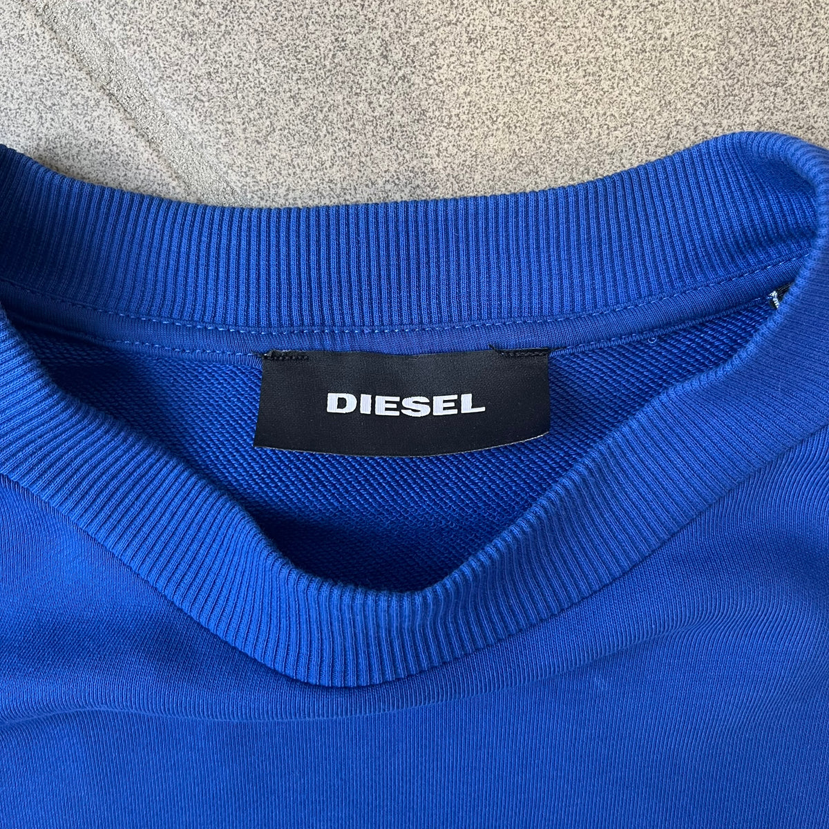 Diesel 2017 "78 mg Pill" Blue Crewneck is a blue, 100% cotton crewneck featuring a large pill graphic in yellow and blue, with black "DIESEL 78 mg" text printed on the yellow half.