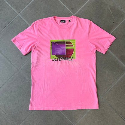Diesel DLVERANCE Bright Pink Tee features a 100% cotton jersey construction with a fluorescent pink pigment-dyed finish. The front has a rubberised “DLVERANCE” graphic, with a small rubber “Copyright” logo on the lower back.