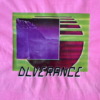 Diesel DLVERANCE Bright Pink Tee features a 100% cotton jersey construction with a fluorescent pink pigment-dyed finish. The front has a rubberised “DLVERANCE” graphic, with a small rubber “Copyright” logo on the lower back.