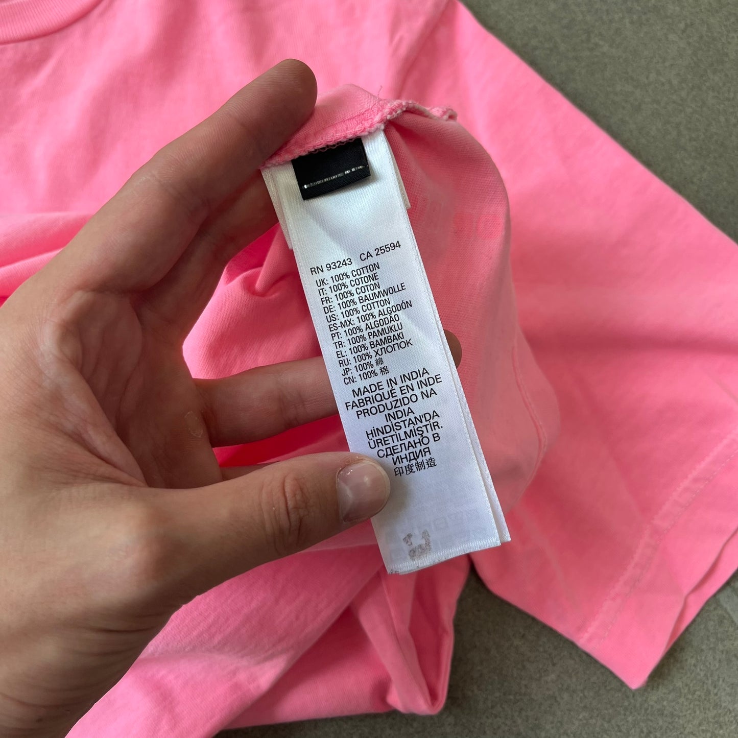 Diesel DLVERANCE Bright Pink Tee features a 100% cotton jersey construction with a fluorescent pink pigment-dyed finish. The front has a rubberised “DLVERANCE” graphic, with a small rubber “Copyright” logo on the lower back.