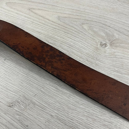 Diesel “Only The Brave” leather belt crafted in Italy from 100% brown leather and finished with a metal buckle with leather front. The buckle displays the Mohawk Warrior helmet motif with surrounding Diesel branding for an iconic look.