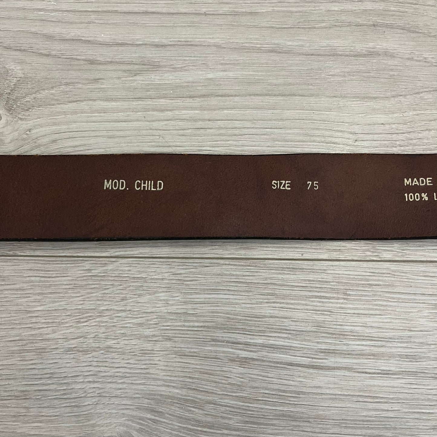 Diesel “Only The Brave” leather belt crafted in Italy from 100% brown leather and finished with a metal buckle with leather front. The buckle displays the Mohawk Warrior helmet motif with surrounding Diesel branding for an iconic look.