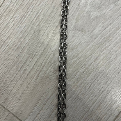 Dolce &amp; Gabbana Propaganda Dog Tag Necklace, featuring a silver stainless steel square tag with four visible screws and the D&amp;G logo engraved on the front. The tag hangs from a durable cable chain, combining sturdy construction with clean, industrial-inspired detailing.