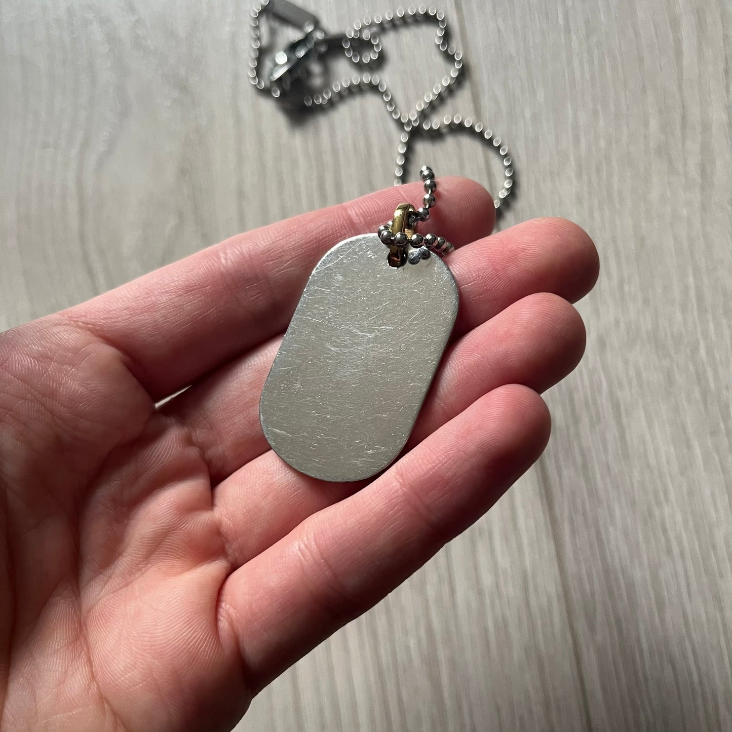 Dolce & Gabbana "I ❤️ D&G" Gold Dog Tag Necklace with a silver stainless steel ball chain, featuring a dog tag engraved with a light "I", a gold metal heart with 3 visible screws, and "D&G" text below, forming the "I ❤️ D&G" design. A playful and collectible vintage piece.