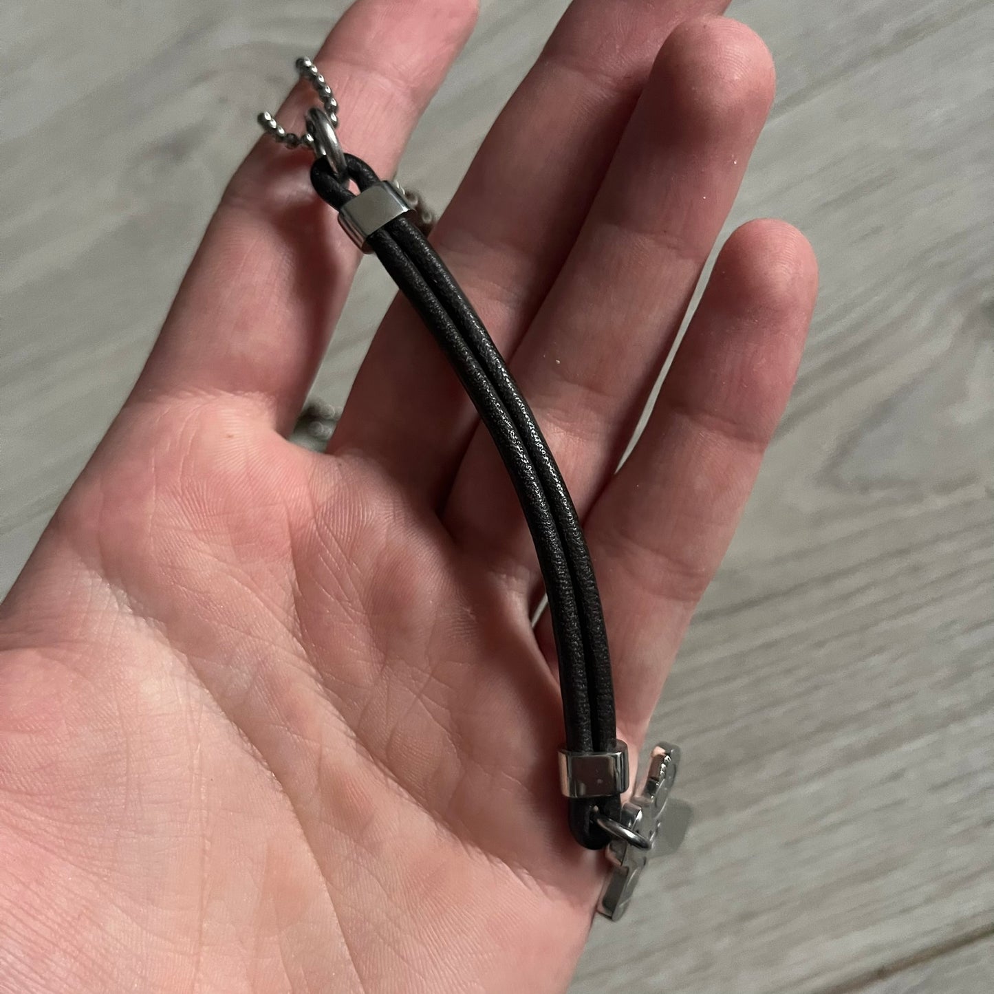 Dolce & Gabbana Pearl Brown Rosary Necklace from the 2000s era. The necklace features a silver-tone metal cross with a D&G logo, connected via a black leather link to a metal chain with alternating brown and yellow pearl-style beads. Rosary-style construction with mixed materials including metal, leather, and resin pearls. Comes complete with the original box.