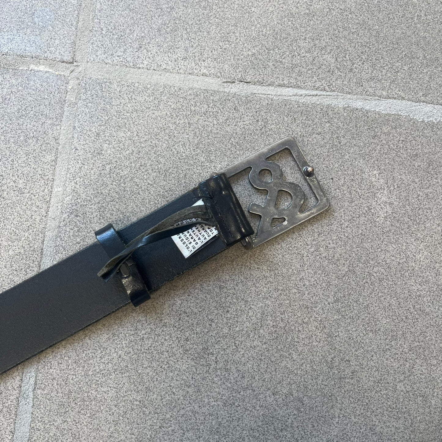  Dolce &amp; Gabbana 2000s Ampersand Black Belt features a black leather strap with a metal ampersand-shaped buckle set inside a square outline. Made in Italy. 