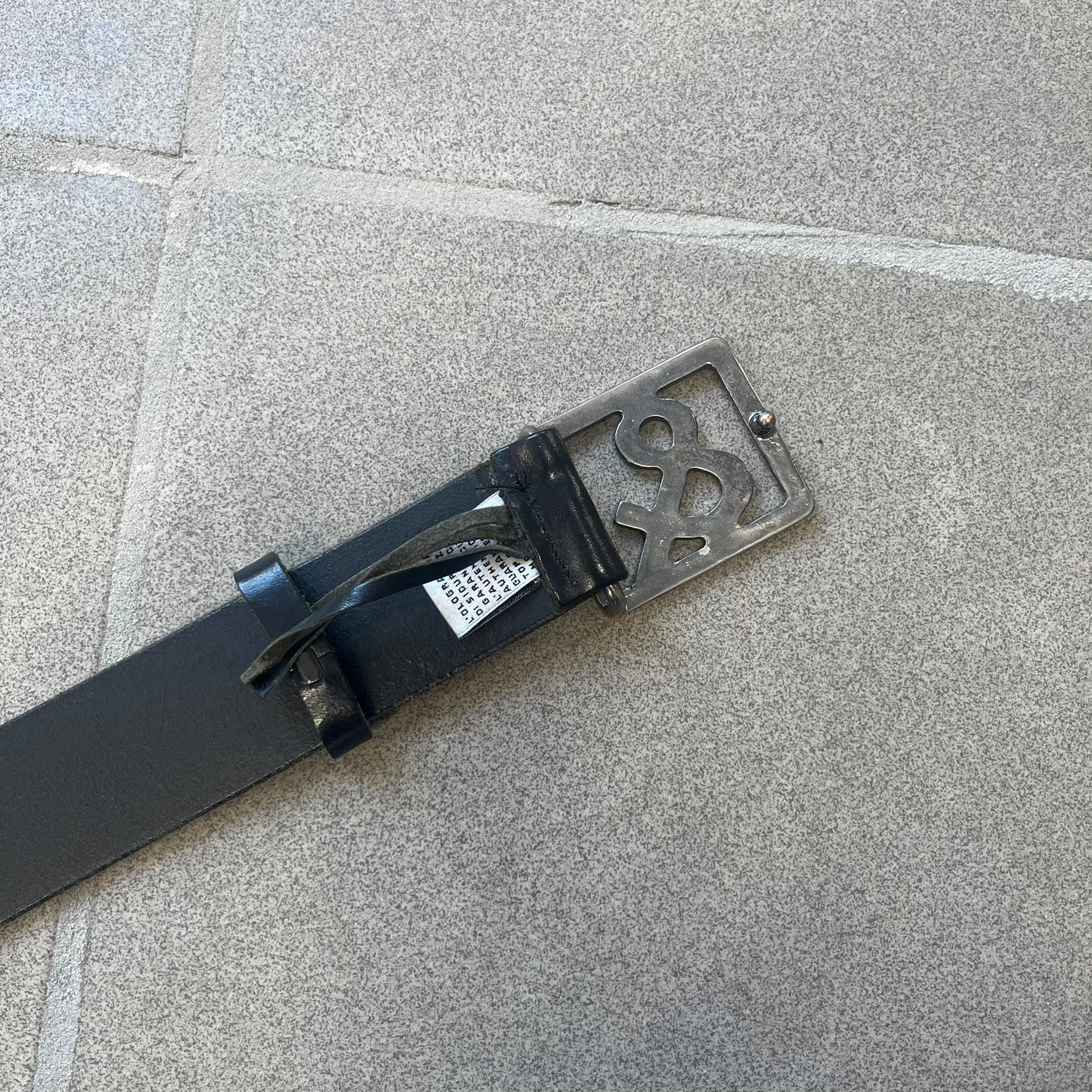  Dolce &amp; Gabbana 2000s Ampersand Black Belt features a black leather strap with a metal ampersand-shaped buckle set inside a square outline. Made in Italy. 