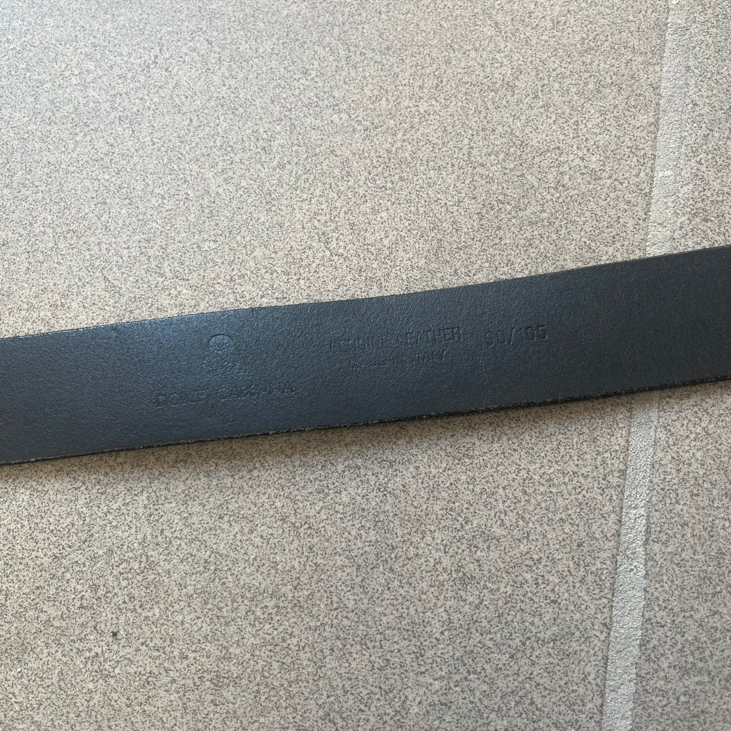  Dolce &amp; Gabbana 2000s Ampersand Black Belt features a black leather strap with a metal ampersand-shaped buckle set inside a square outline. Made in Italy. 