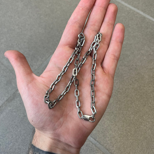Dolce & Gabbana 2000's Basic Chain Necklace is a stainless steel paperclip chain made in Italy, featuring a clasp engraved with the D&G logo.