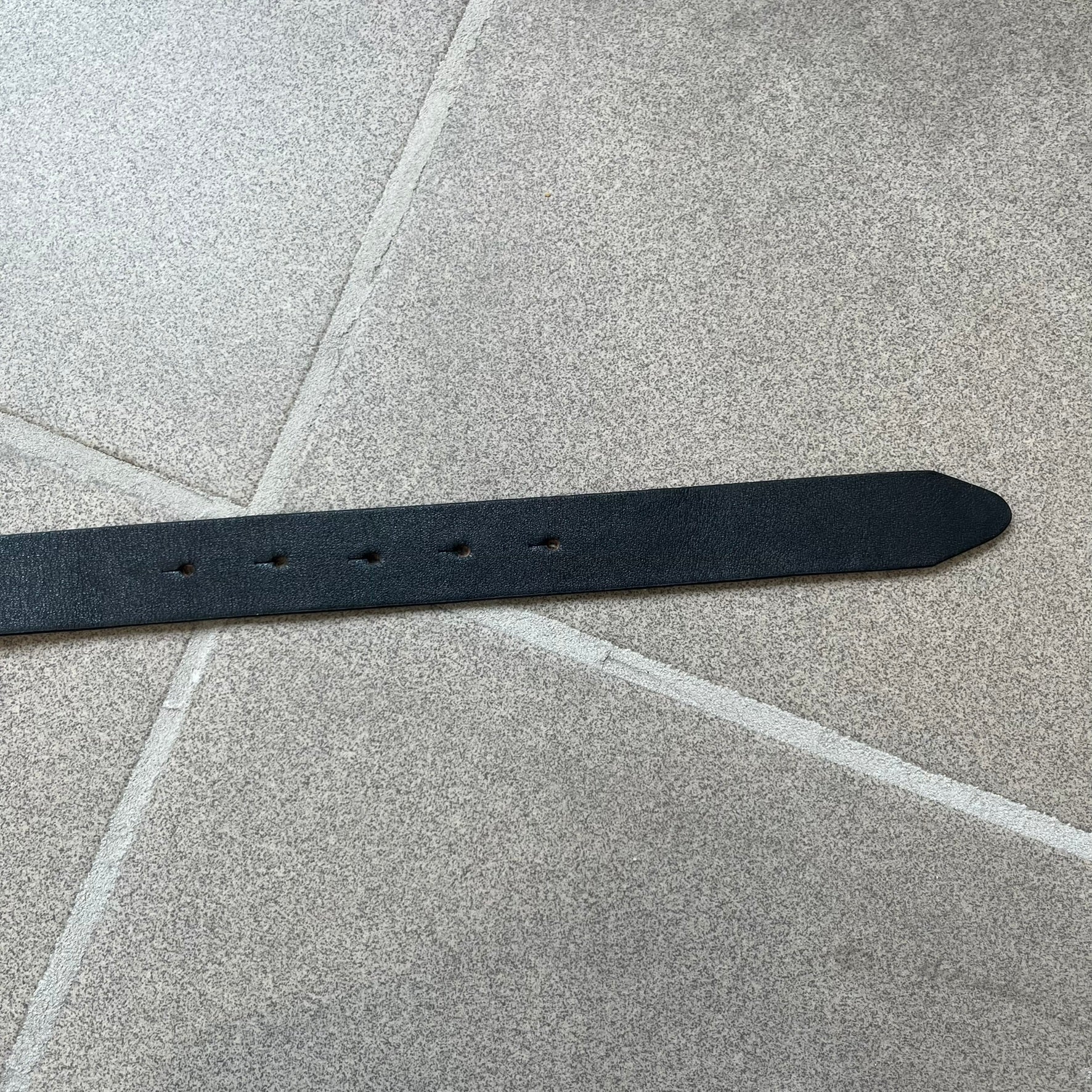 Dolce &amp; Gabbana 2000s Black Crystal Buckle Belt features a black leather strap with a stainless steel D&amp;G logo buckle. The buckle has a decorative italic-style font and is fully covered with crystal/rhinestone detailing on the front. Made in Italy.