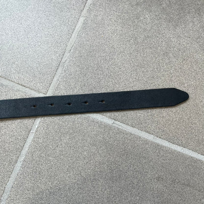 Dolce &amp; Gabbana 2000s Black Crystal Buckle Belt features a black leather strap with a stainless steel D&amp;G logo buckle. The buckle has a decorative italic-style font and is fully covered with crystal/rhinestone detailing on the front. Made in Italy.