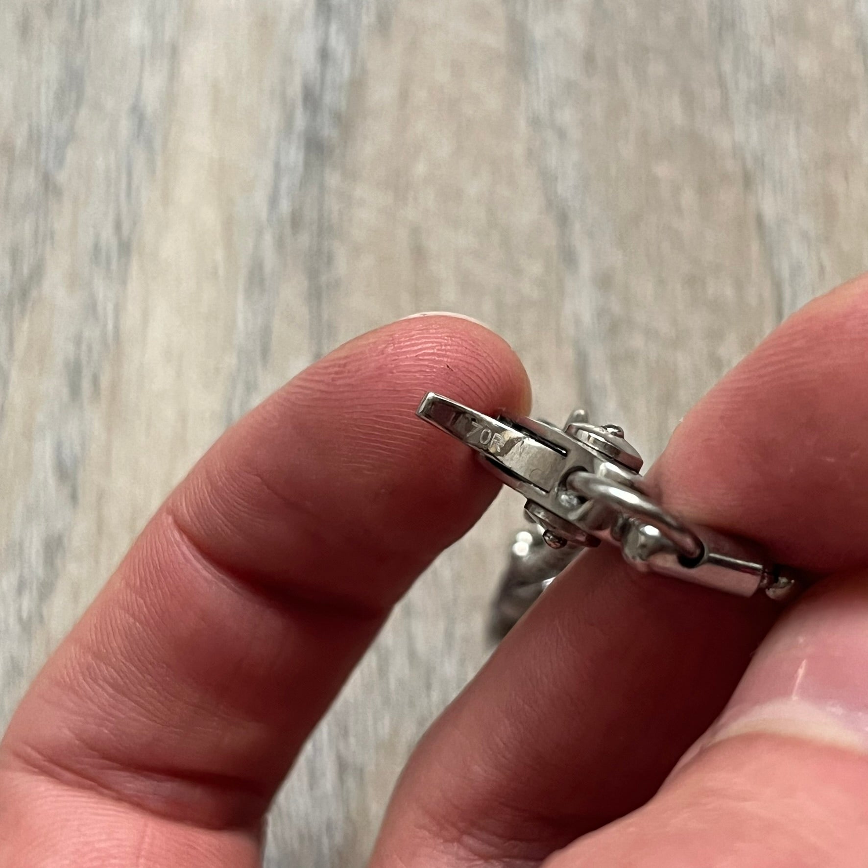 Dolce &amp; Gabbana Cowboy Dog Tag Necklace, model DJ0633. Features a silver-tone metal ball chain and a dog tag with black cowboy-style D&amp;G logo and small “Dolce &amp; Gabbana” text underneath. The front of the tag is patterned with subtle white dots for added detail.