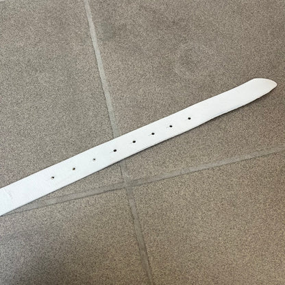 Dolce &amp; Gabbana 2000's Crystal Buckle White Belt features a white leather strap with a stainless steel D&amp;G logo buckle. The buckle has a decorative italic-style font and is fully covered with crystal/rhinestone detailing on the front. Made in Italy.