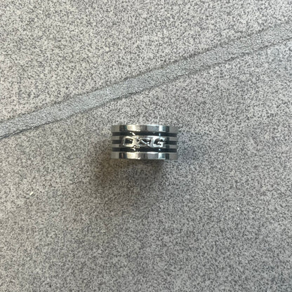 Dolce &amp; Gabbana stainless steel ring DJ0709 in silver, featuring three subtle black engraved stripes encircling the band. The D&amp;G logo is displayed in polished silver on top, creating a nice contrast with the dark detailing.