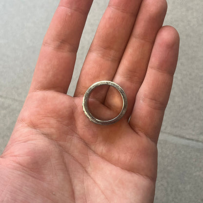 Dolce &amp; Gabbana stainless steel ring DJ0709 in silver, featuring three subtle black engraved stripes encircling the band. The D&amp;G logo is displayed in polished silver on top, creating a nice contrast with the dark detailing.