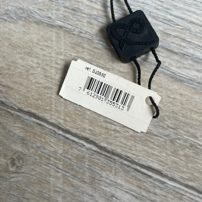 Dolce & Gabbana 2000s Overlap Logo Necklace DJ0530 is a necklace featuring a pendant with overlapping D&G letter cutouts in a slightly raised 3D design. The back of the pendant is flat with a small engraved D&G logo. It is attached to an adjustable cord chain with a regulator closure.
