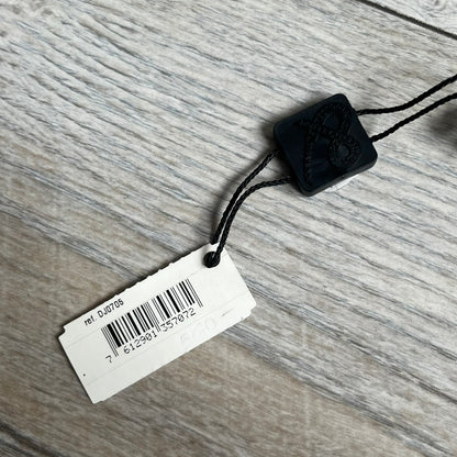 Dolce & Gabbana 2000s Radiator Necklace DJ0705 is a necklace featuring a square-link chain combined with a black leather cord. The pendant is made from stainless steel with a square frame design that includes black and silver line detailing resembling a radiator structure. A raised D&G logo is positioned in the center of the ID plate, while the back is black, visible through the open metal line design.
