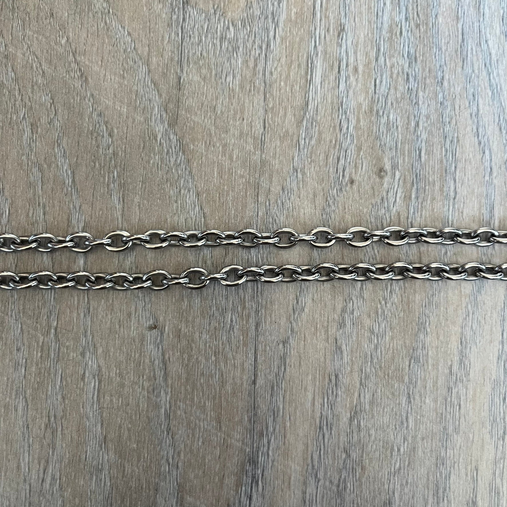 Dolce & Gabbana 2000s Round D&G Logo Necklace is a chain necklace featuring a lobster clasp closure and a thick 3D circular pendant with cut-out center and D&G logo in the middle. The pendant connector is embellished with crystal detailing. The necklace comes with a brown Dolce & Gabbana dust bag.