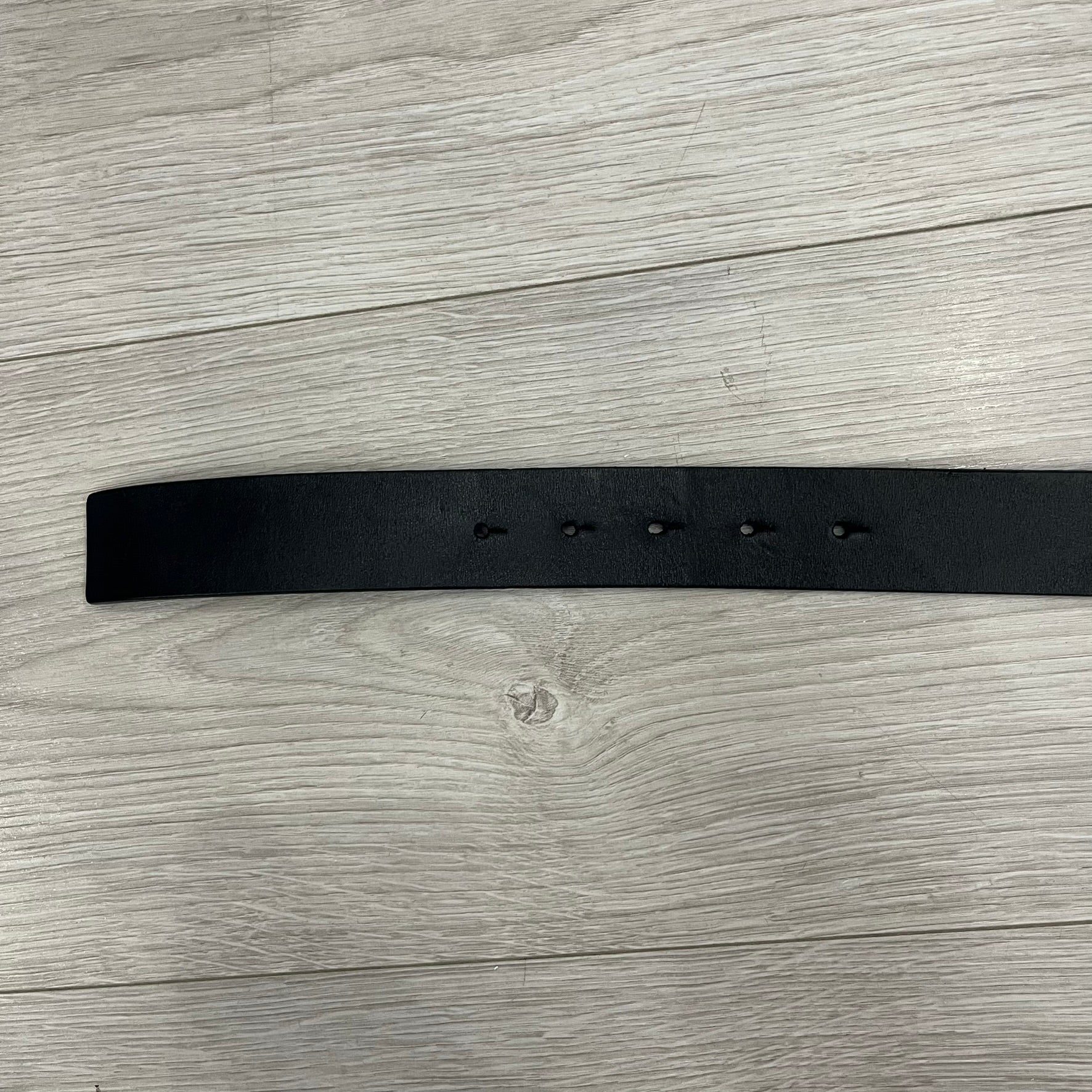 Dolce &amp; Gabbana 2000s Silver/Gold Bars Belt crafted from black leather with a solid metal buckle plate. The buckle features three horizontal metal bars secured with visible screws, with silver-tone bars on the top and bottom and a gold-tone center bar engraved with the D&amp;G logo. Finished with a structured leather strap, comes with the original dustbag.