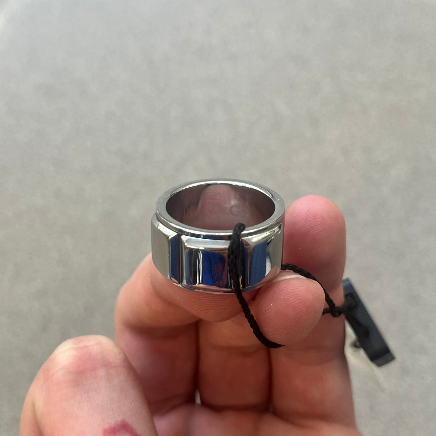 Dolce &amp; Gabbana DJ0836 Ring is made from silver-tone metal and features three raised square elements set across the top. Next to the squares, there is a small engraved D&amp;G logo. The ring has a clean, minimal design and is marked with model code DJ0836.