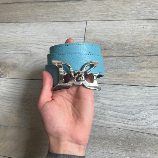 Dolce &amp; Gabbana 2008 Butterfly Buckle Baby Blue Leather Belt from the AW2008 collection. Crafted from smooth Baby Blue leather with visible edge stitching, this belt features a big silver-tone D&amp;G logo buckle shaped in a butterfly-style form. The buckle has a polished metal finish, while the belt itself is made from 100% leather and retains a clean, structured profile. An original seasonal accessory from Dolce &amp; Gabbana’s AW2008 season.